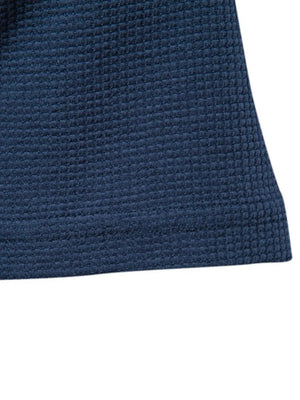 Navy crew-neck t-shirt knit with a textured waffle weave.