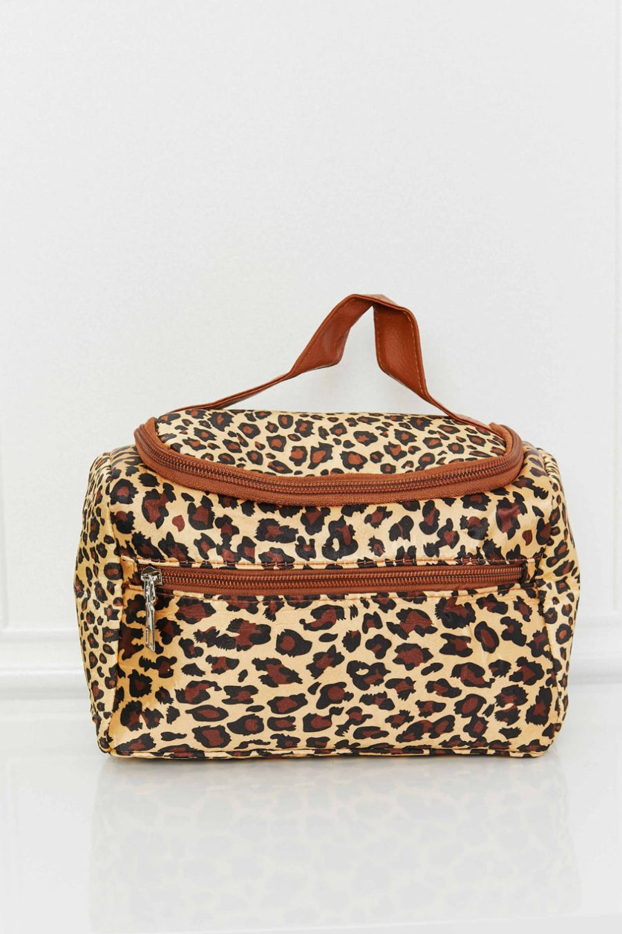 Leopard print travel organizer bag with brown trim and handle