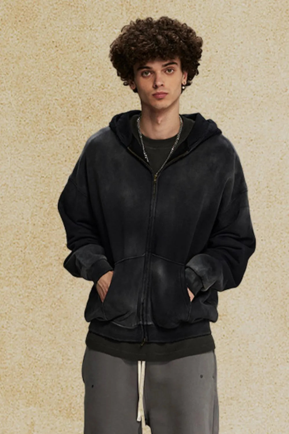 Ombre washed black zip-up hoodie with a relaxed fit and front pockets.
