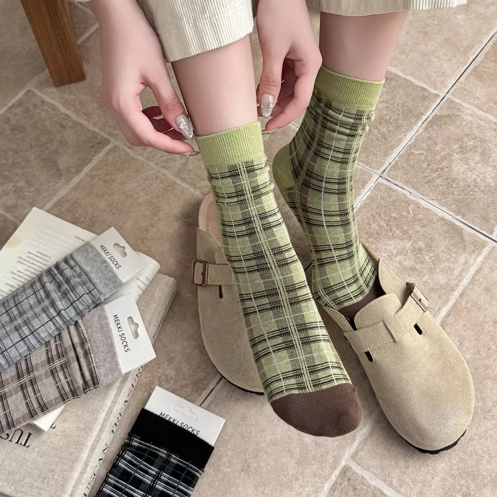 chocolate brown socks featuring elastic cuff and plaid