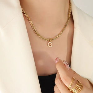 Gold chain necklace with a zircon-set initial G pendant