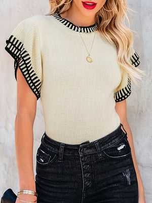 Cream knit crew neck sweater with black striped ruffled sleeves and neckline.