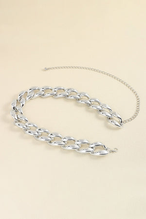 Silver sculptural chain belt with acrylic links and a delicate extender chain.