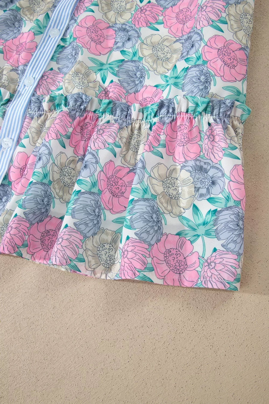 Floral mini dress with button front, contrast trim, and ruffled waist