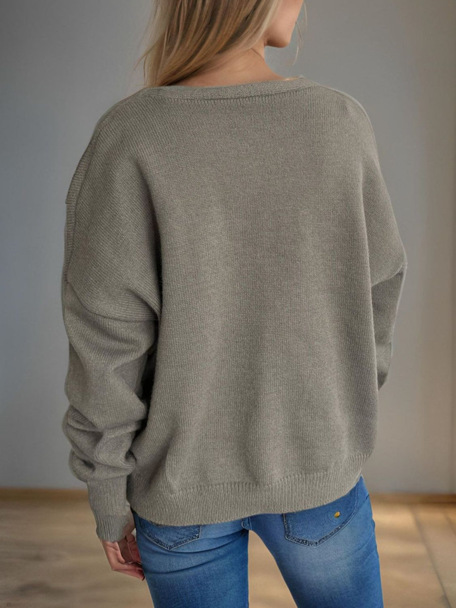 Gray oversized knit cardigan with crew neck and button front, acrylic material