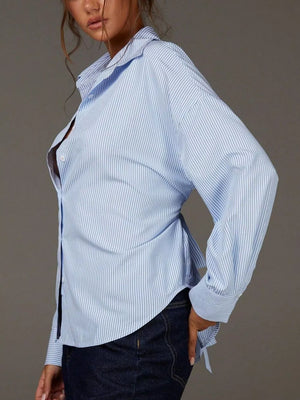 50% viscose, 50% polyester Care instructions: Machine wash cold button-down shirt in Blue with relaxed silhouette
