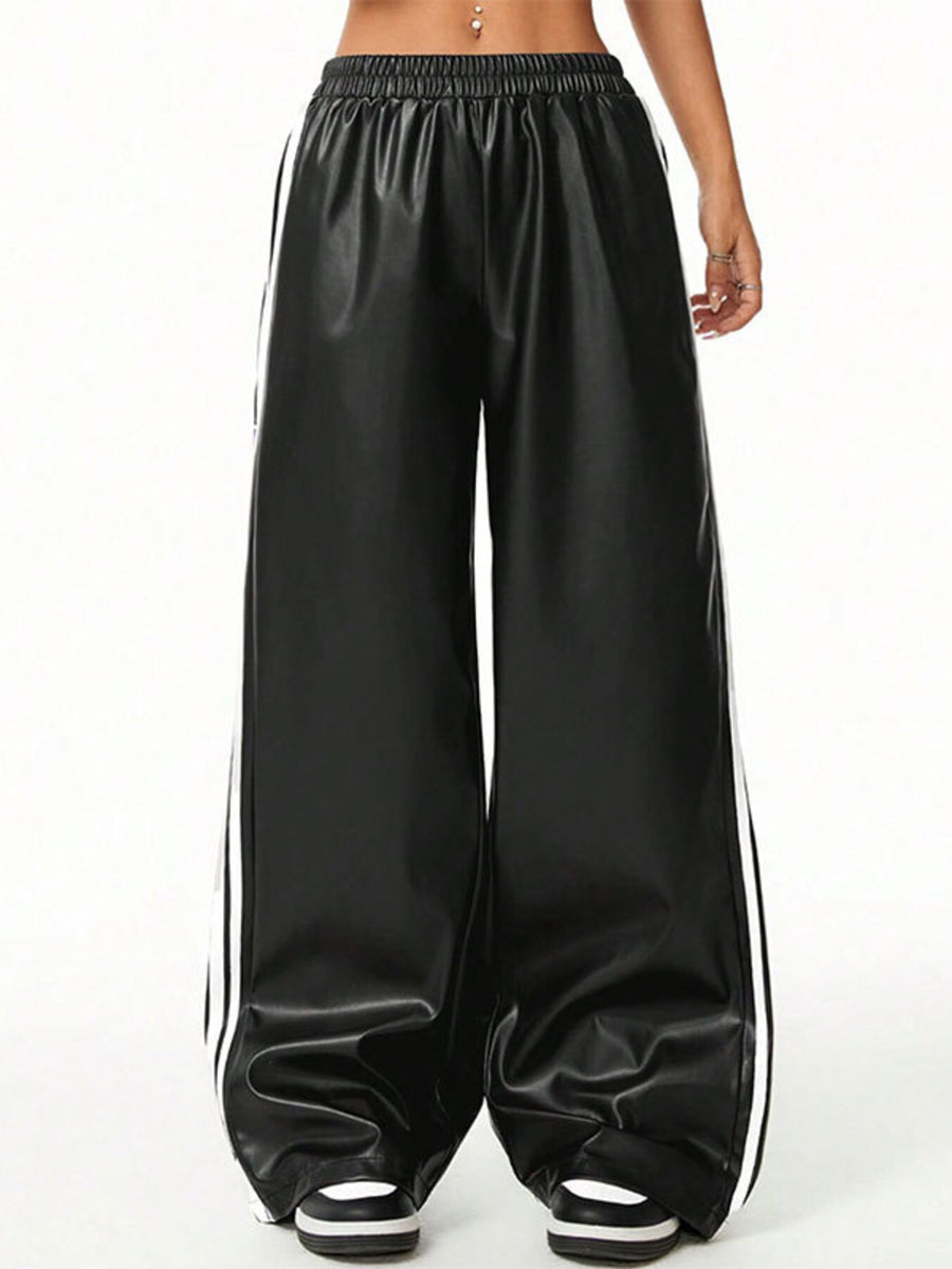 Black faux leather wide leg track pants with white side stripes and elastic waistband.