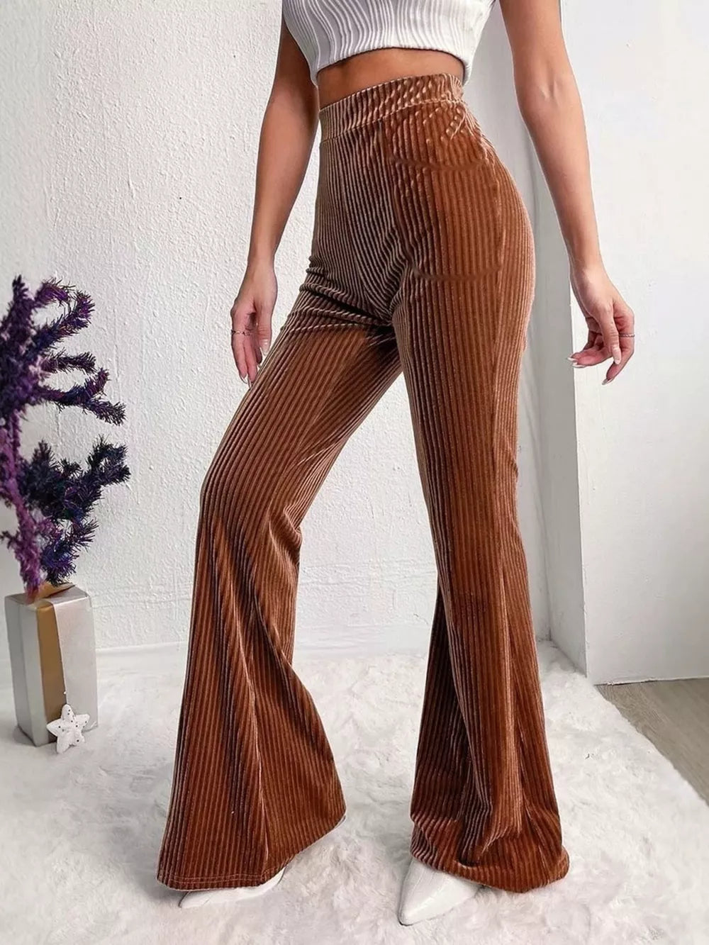 Caramel flare pants featuring high-waisted and ribbed