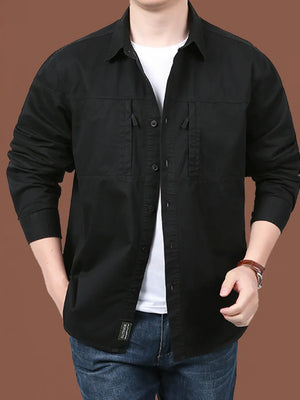 Men's black cotton relaxed fit button-front shirt with dual chest pockets.