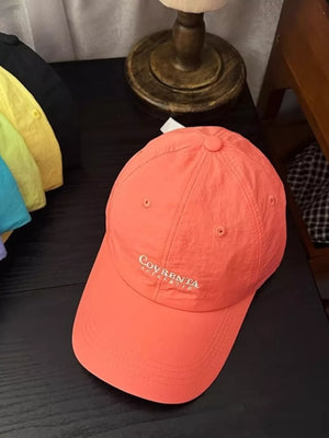 Orange red cotton baseball cap with embroidered logo detail
