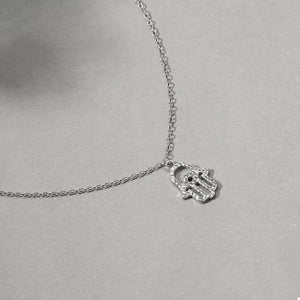 Silver evil eye hamsa hand pendant necklace with rhinestones