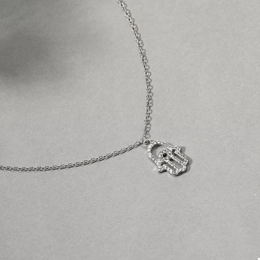 Silver evil eye hamsa hand pendant necklace with rhinestones