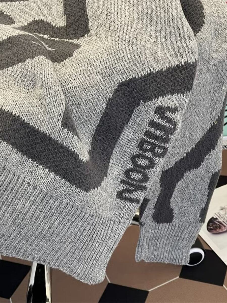 Grey knit sweater with dark grey graphic pattern and lettering