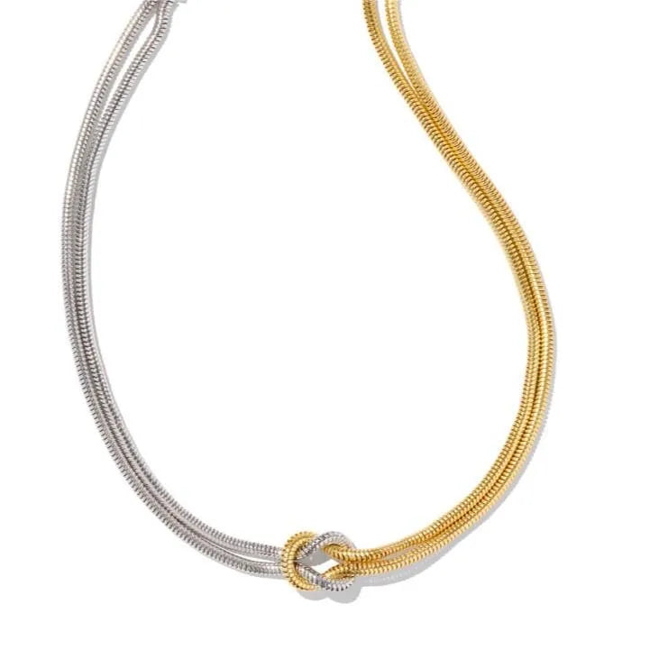 Two-tone serpent knot necklace in gold and silver montage with snake chain detail