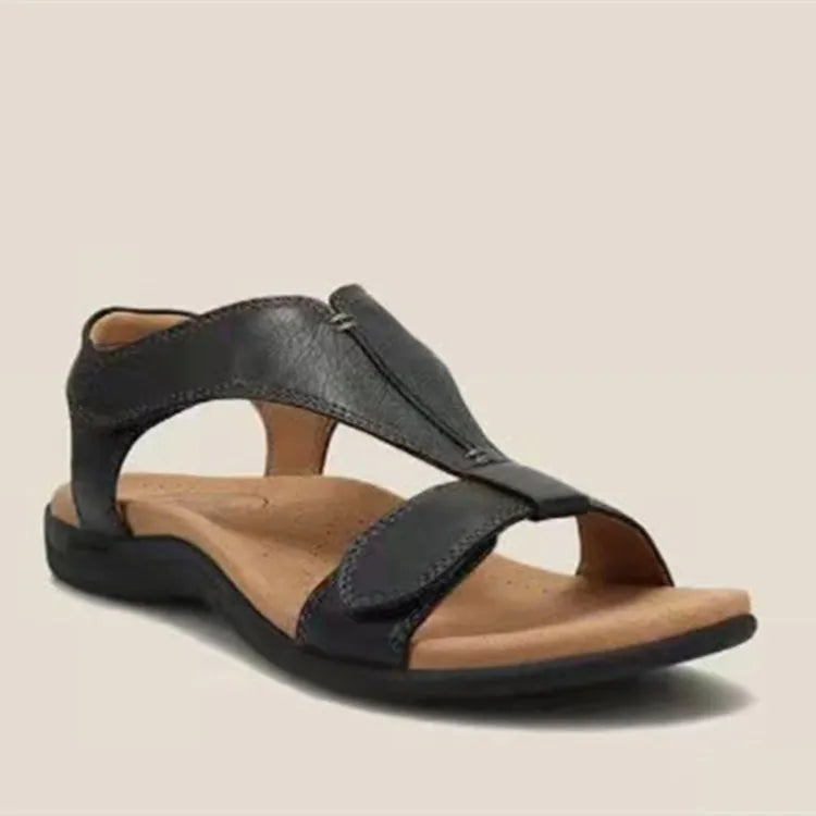 Black leather T-strap comfort sandals with adjustable straps and cushioned footbed.