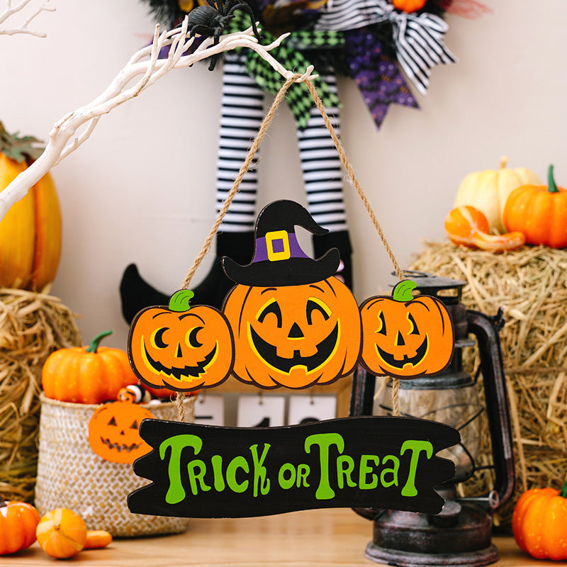 Halloween sign trio with three jack-o-lanterns and Trick or Treat banner.