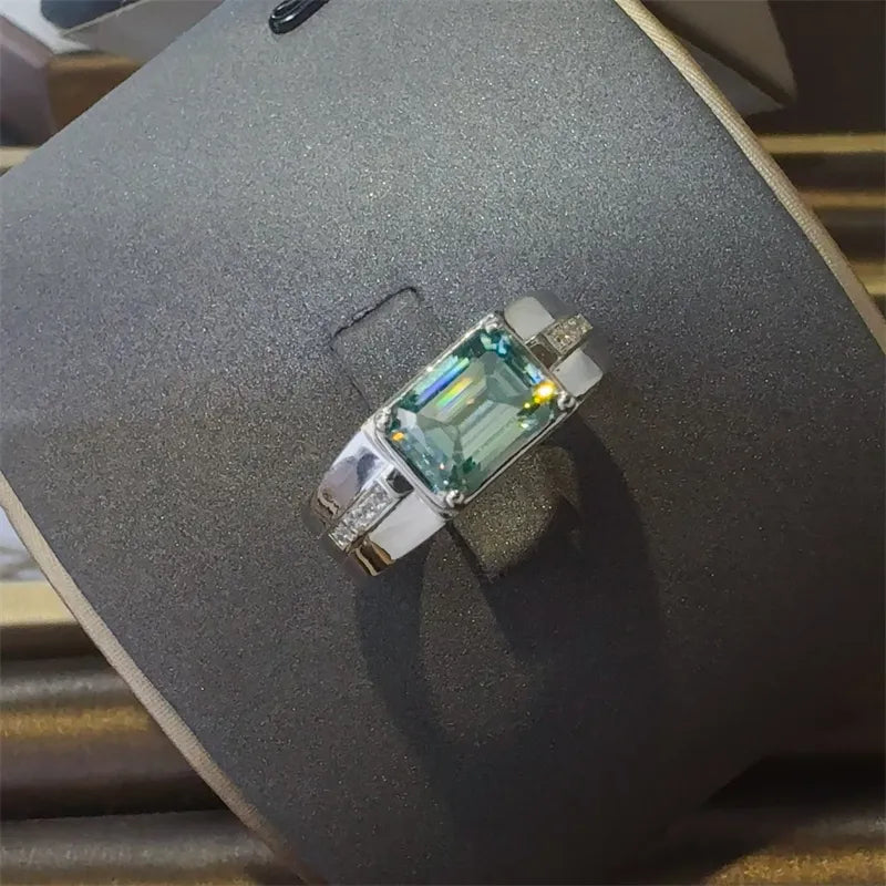 Sterling silver ring with emerald cut moissanite and diamond accents