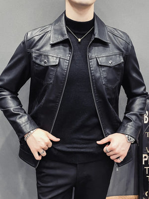 Men's black faux leather trucker jacket with chest pockets and zip closure.