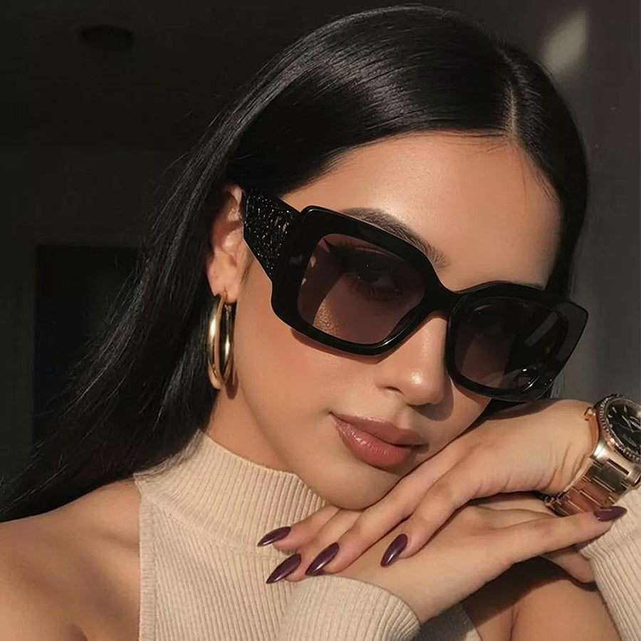 sunglasses in black featuring UV400 protection and oversized fit