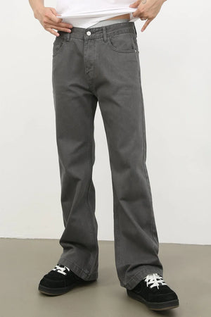Wide-leg washed denim trousers in dark gray with a relaxed fit.
