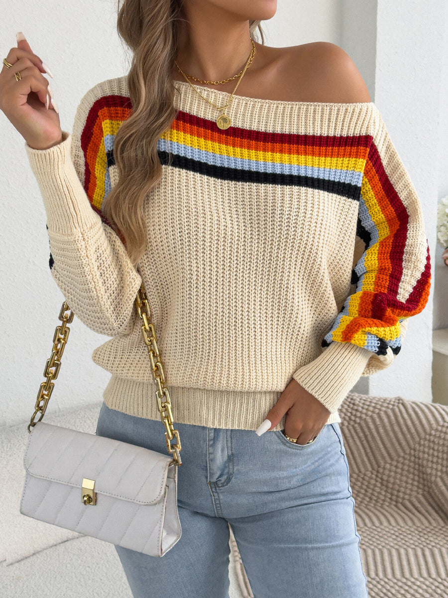 red pullover sweater featuring ribbed stretch and striped