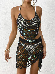 Black crochet cover up set with iridescent sequins, halter top and drawstring skirt.