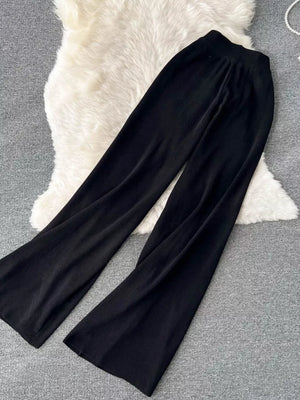 Black wide leg pants with tied waist detail