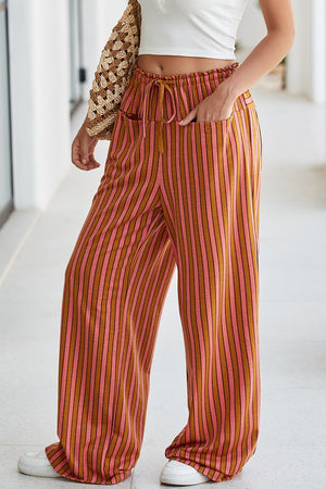 Wide leg pants with pink and brown vertical stripes, drawstring waist, and pockets.