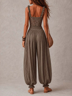 Beige jumpsuit featuring lace bodice and floral