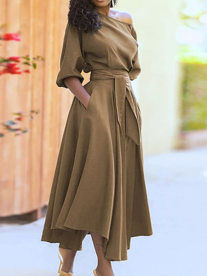 Off-the-shoulder belted dress in camel with puff sleeves and a flowy skirt.