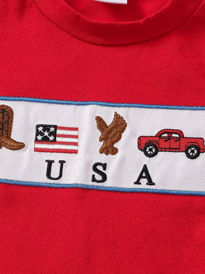 Red baby set with USA embroidery featuring boots, flag, eagle, and car.