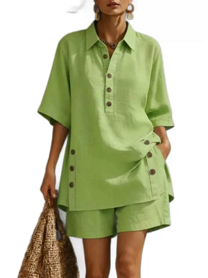 Green linen shorts with button detail, part of a two-piece ensemble.