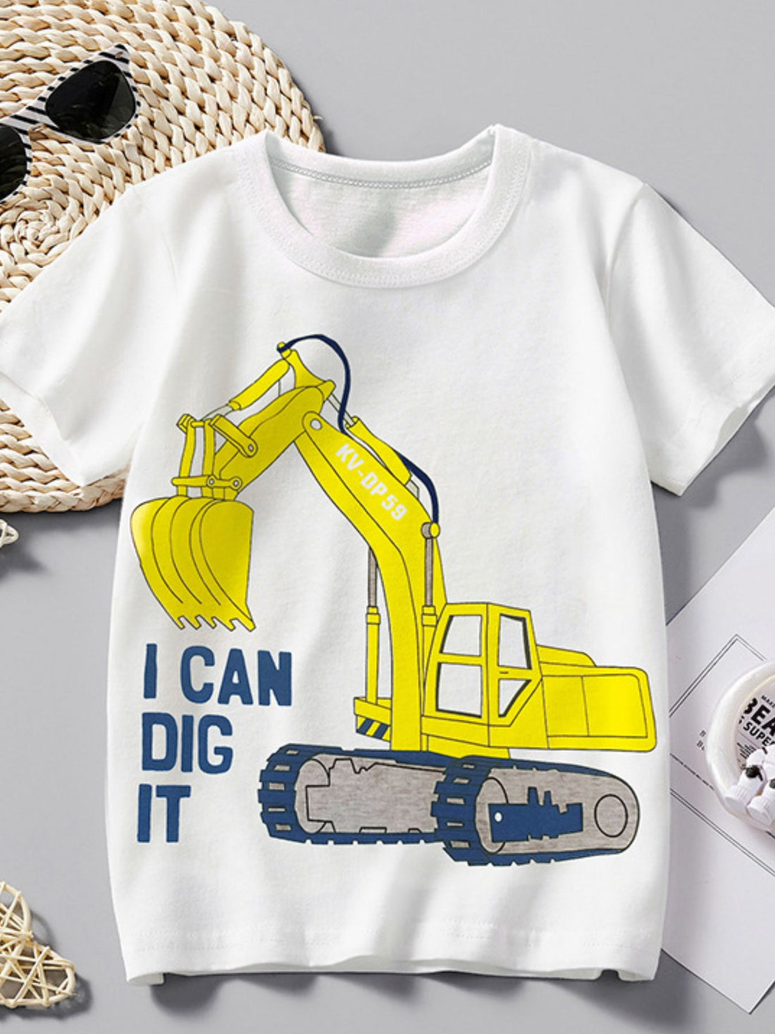 White cotton crew neck t-shirt with yellow excavator graphic and "I CAN DIG IT" text.