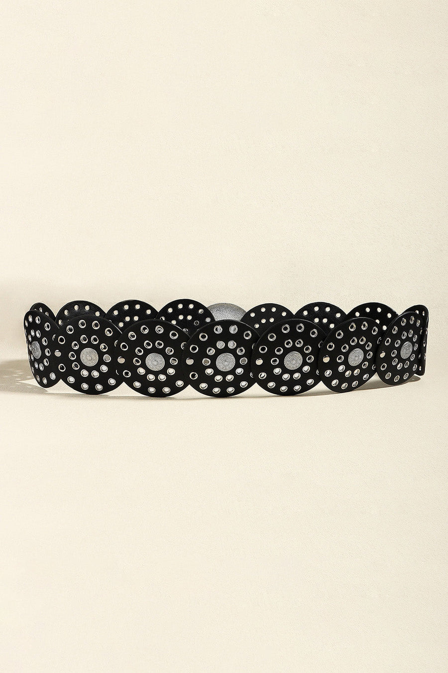 Black statement belt with silver disc embellishments and eyelet details.