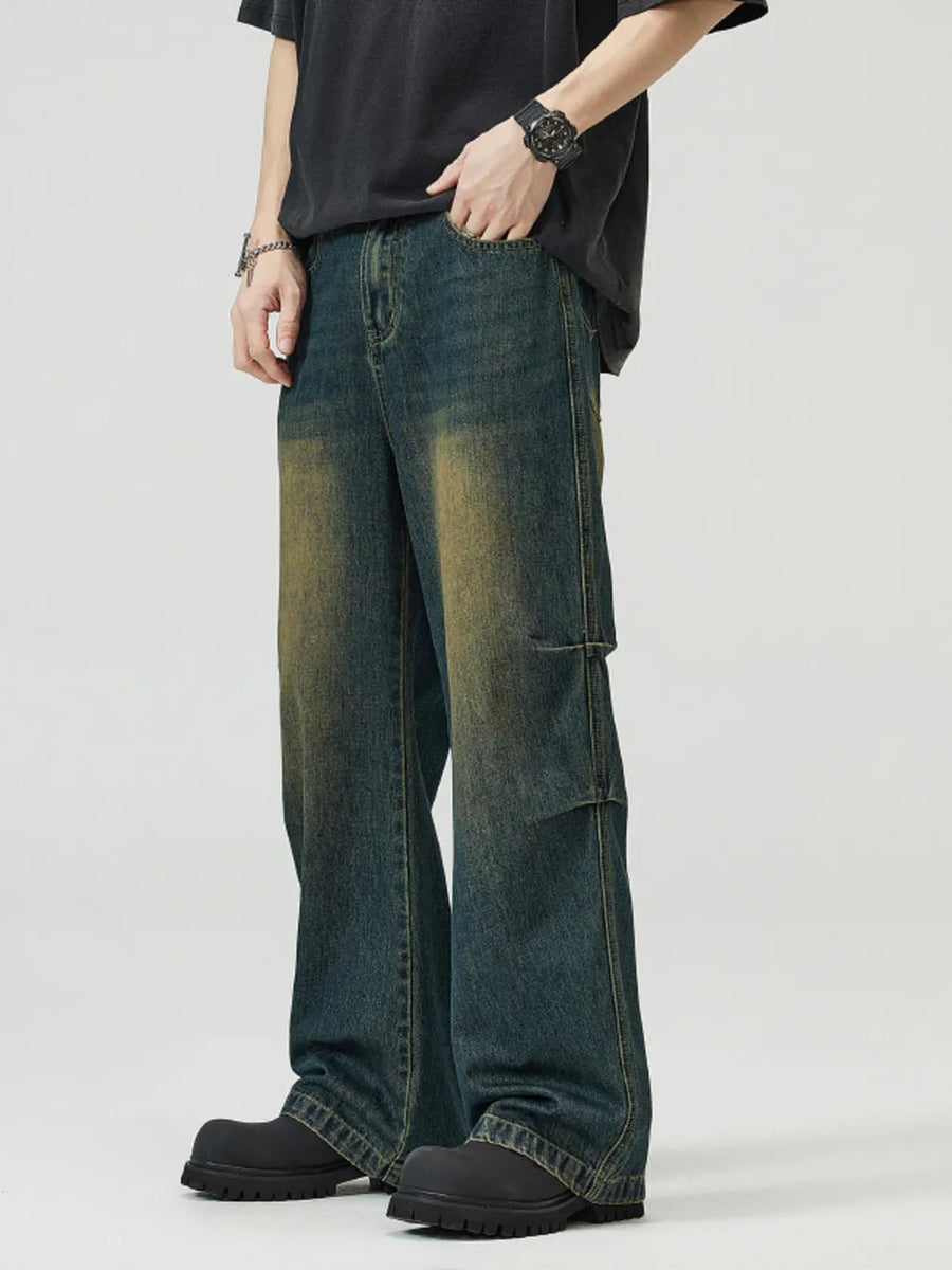 Men's vintage wash wide-leg jeans in blue-green denim with a relaxed fit.