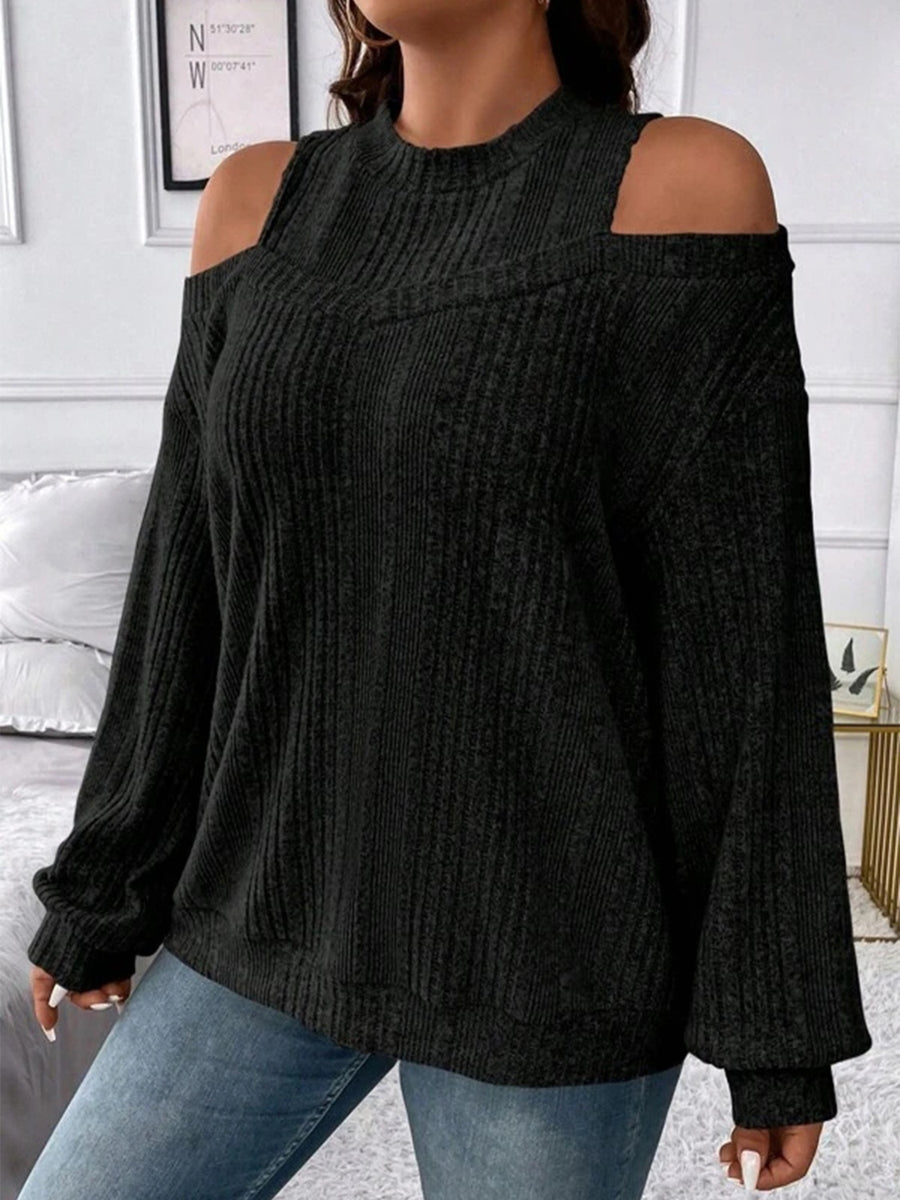 Black ribbed mock neck cold shoulder top with long sleeves.