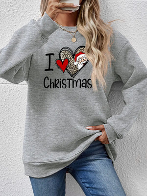 Light gray crewneck sweatshirt with a festive heart graphic featuring Santa and leopard print.