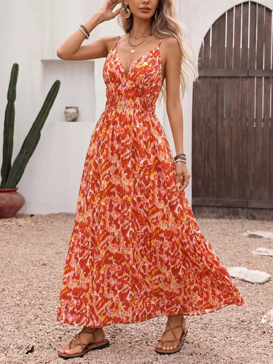 Maxi dress with abstract print, V-neck, spaghetti straps, and smocked waist.