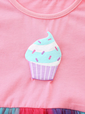 Pink cotton baby dress with cupcake graphic and ruffled tulle hem.