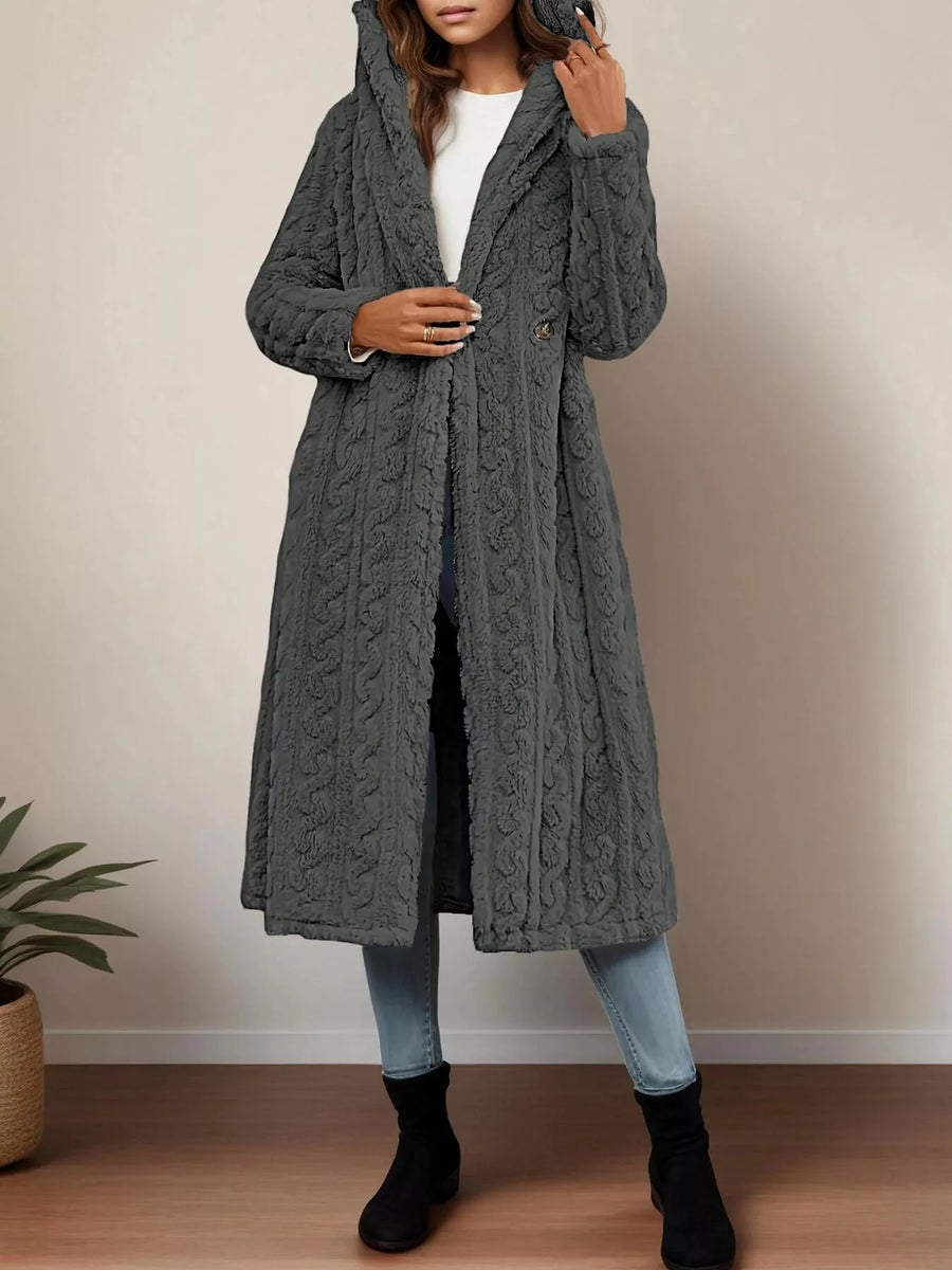 Gray hooded longline button up coat with textured cable knit pattern and open front.