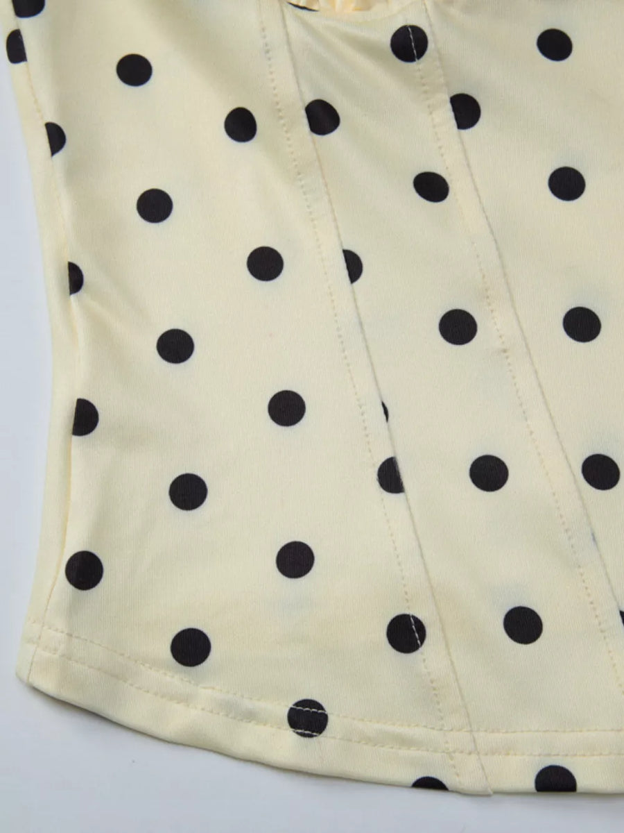Pastel yellow polka dot tank top with sweetheart neckline and darted seams.