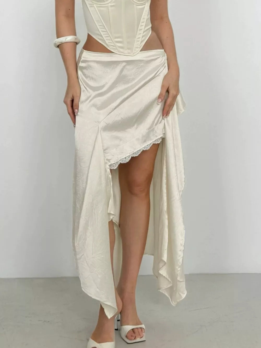 100% polyester Care instructions: Machine wash cold midi skirt in Apricot with flared silhouette