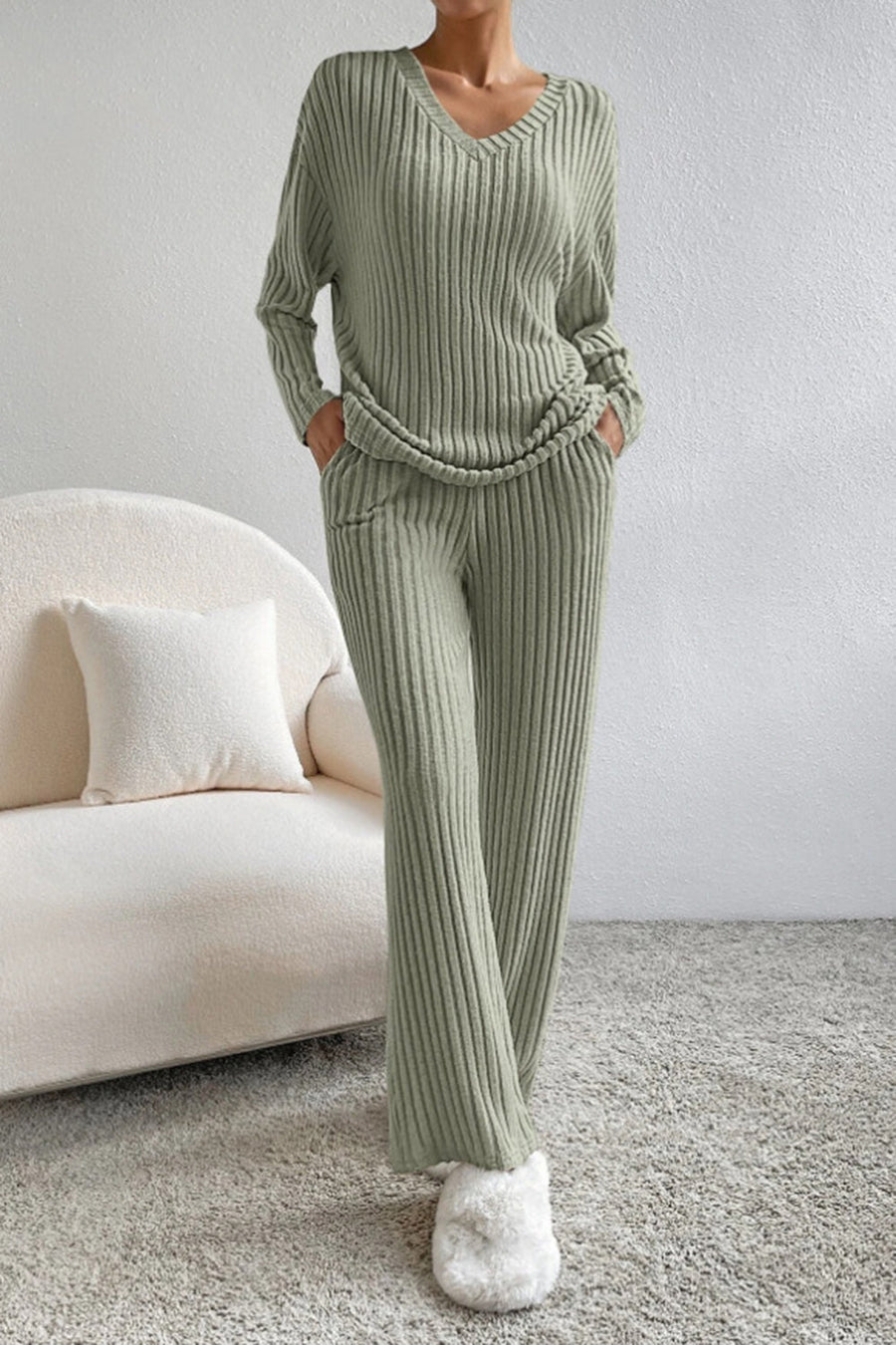 Sage ribbed knit loungewear set with v-neck sweater and wide-leg pants.