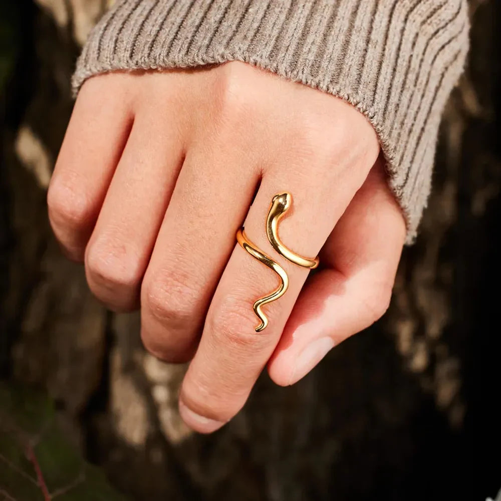 Gold finish serpentine coil ring with a bypass design.