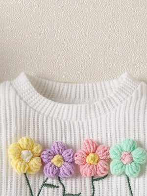 Baby girls' white waffle knit top with colorful floral appliques and embroidered stems.