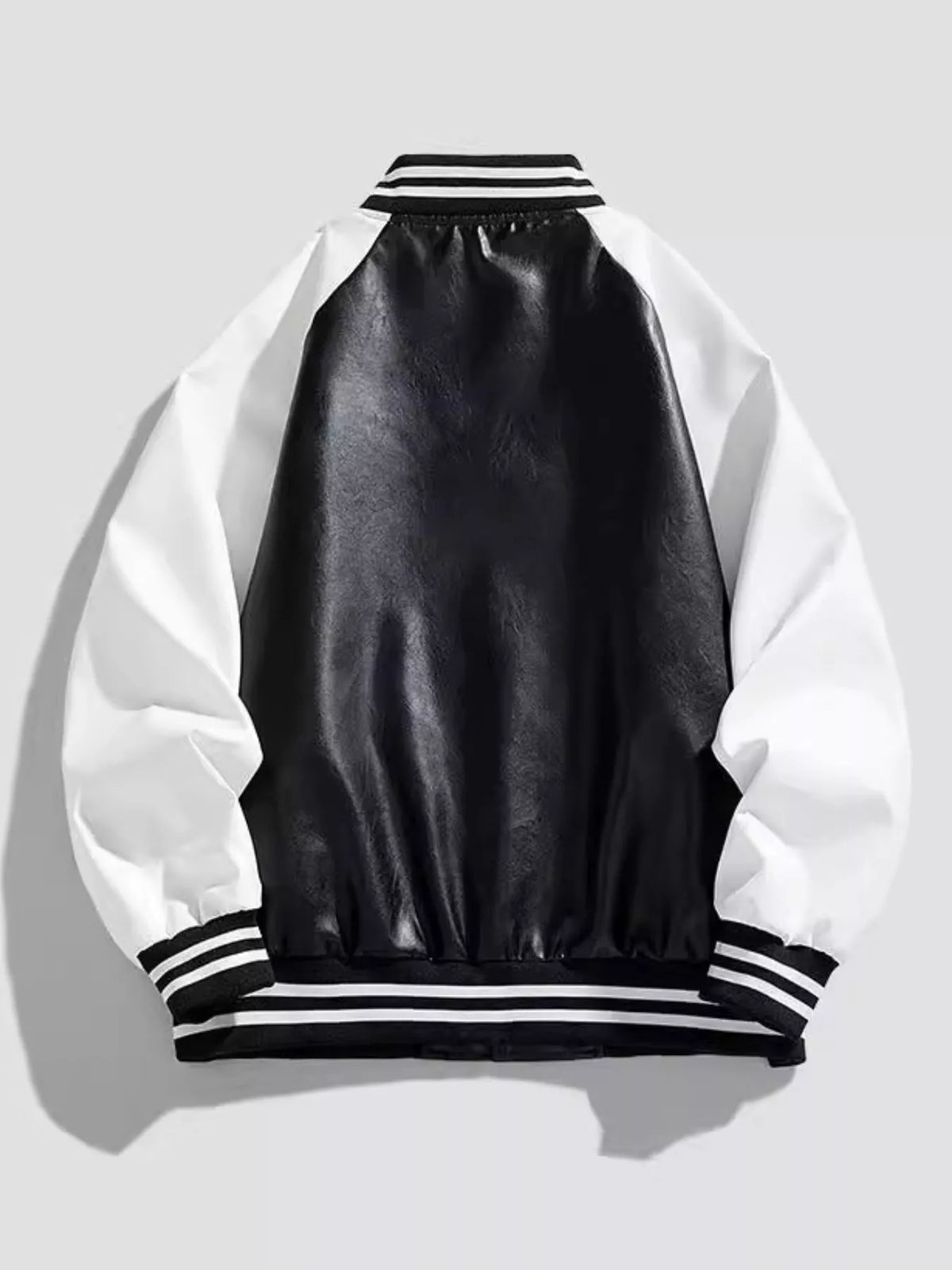 Men's black and white varsity jacket with striped collar and cuffs