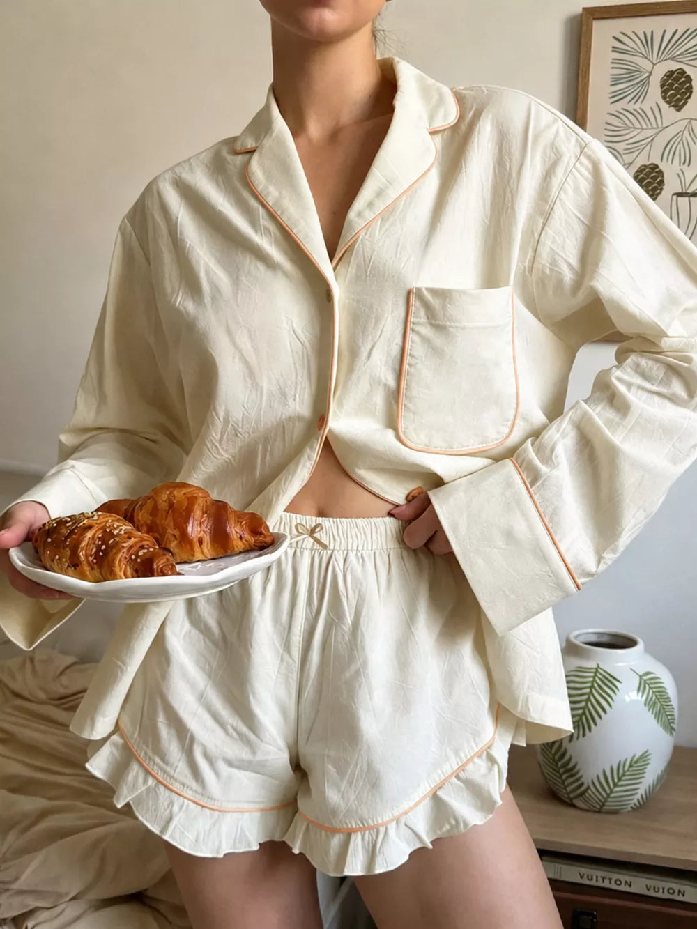 pajama set in cream featuring buttoned and relaxed fit