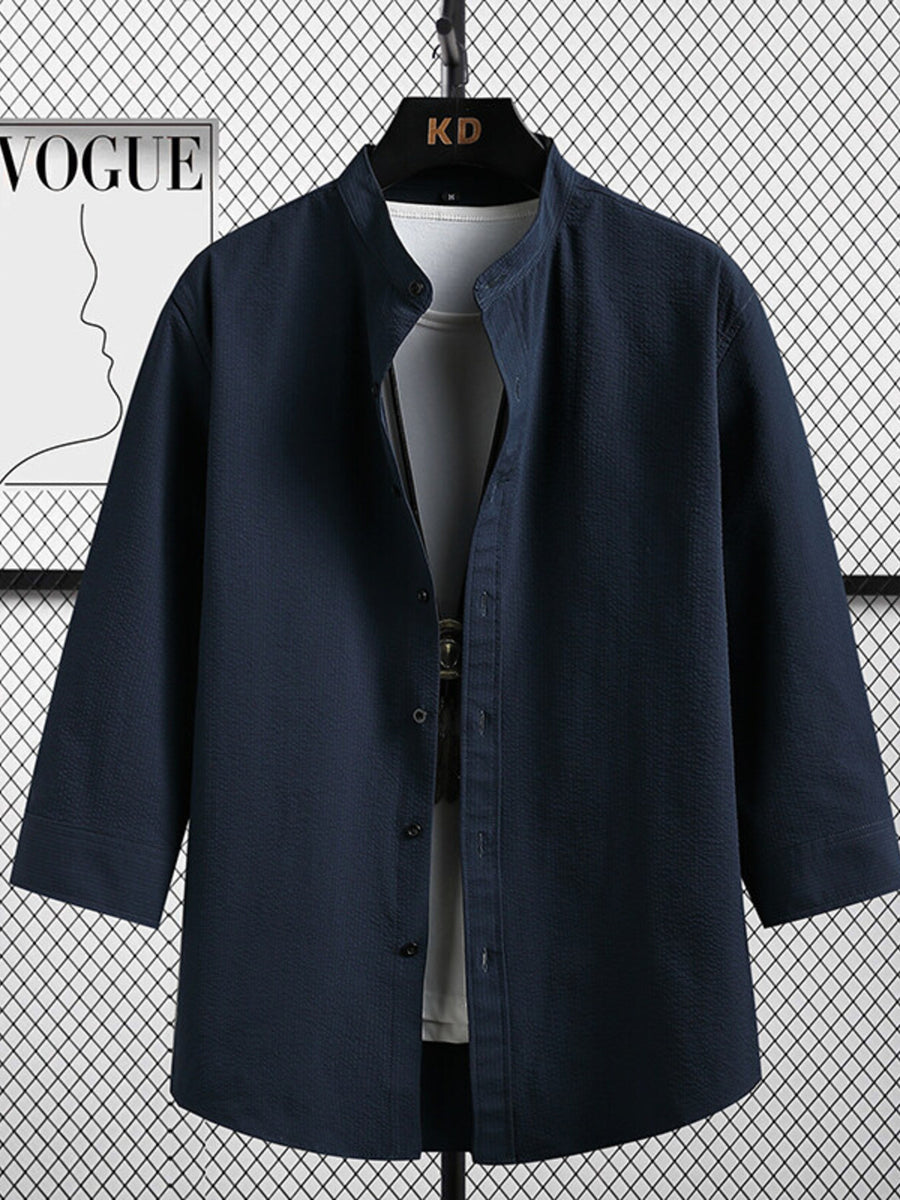 Navy textured band collar shirt with 3/4 sleeves and button front.