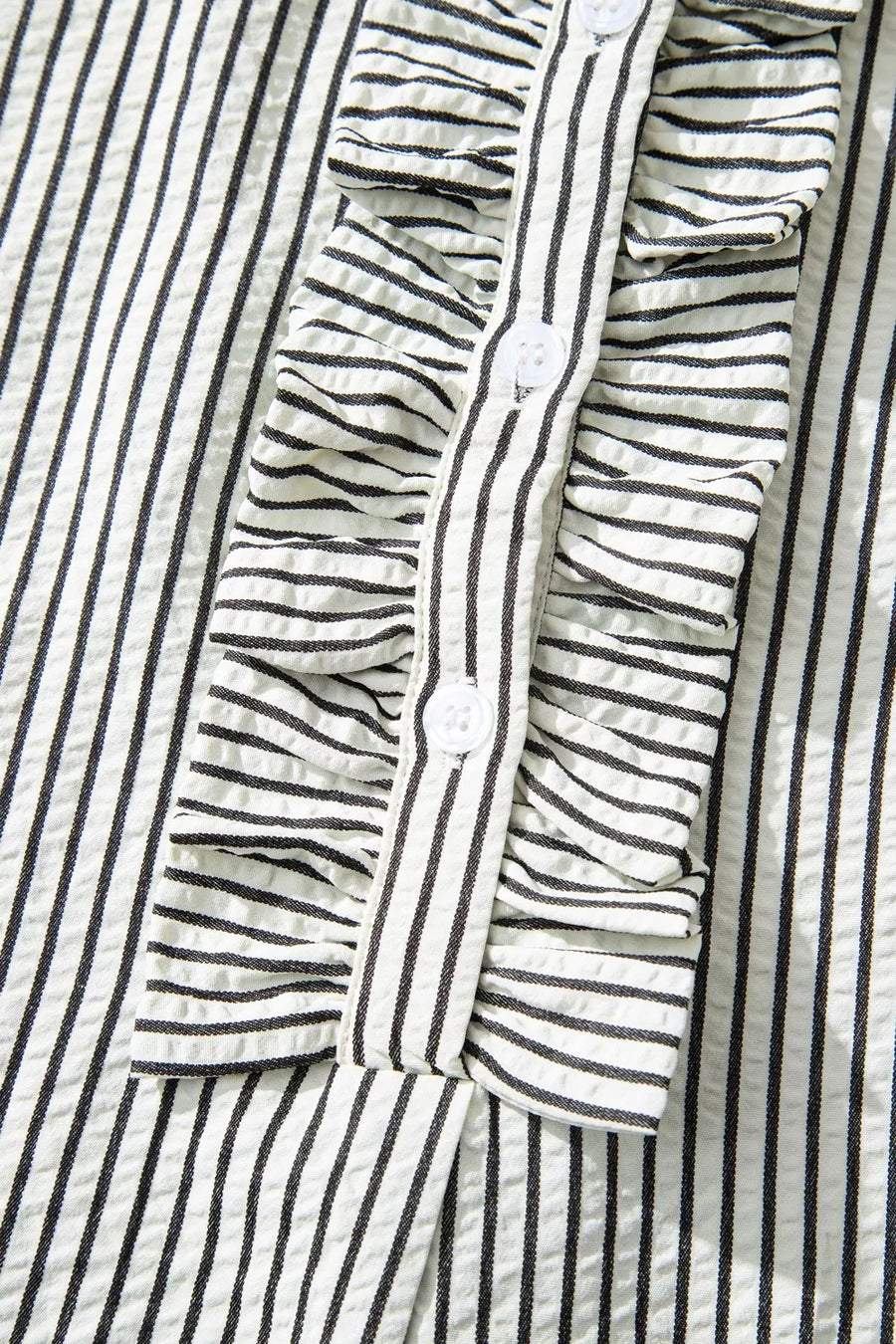 Chic striped ruffle maxi dress with button-down front and cap sleeves.