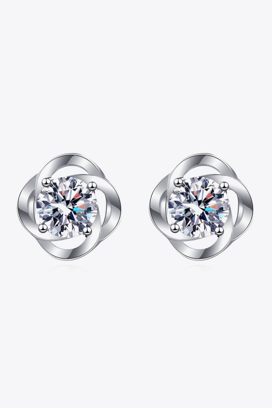 Silver four-leaf clover stud earrings with a central sparkling stone